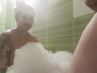 Couple take a bath and he touch her busty body