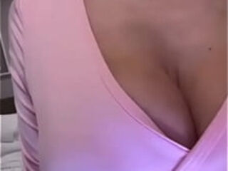 Stepmom in pink caresses her big tits