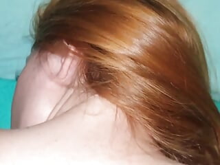 Redhead soaked in oil indulges in her pleasure