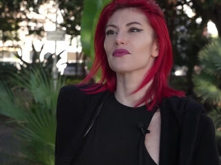 Classy French redhead fitted a pair of big cocks in loud interracial trio