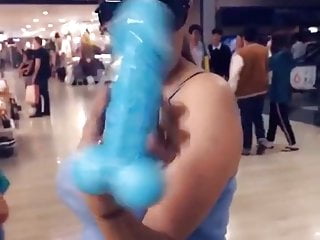 Indian girl displaying penis shaped soap in mall